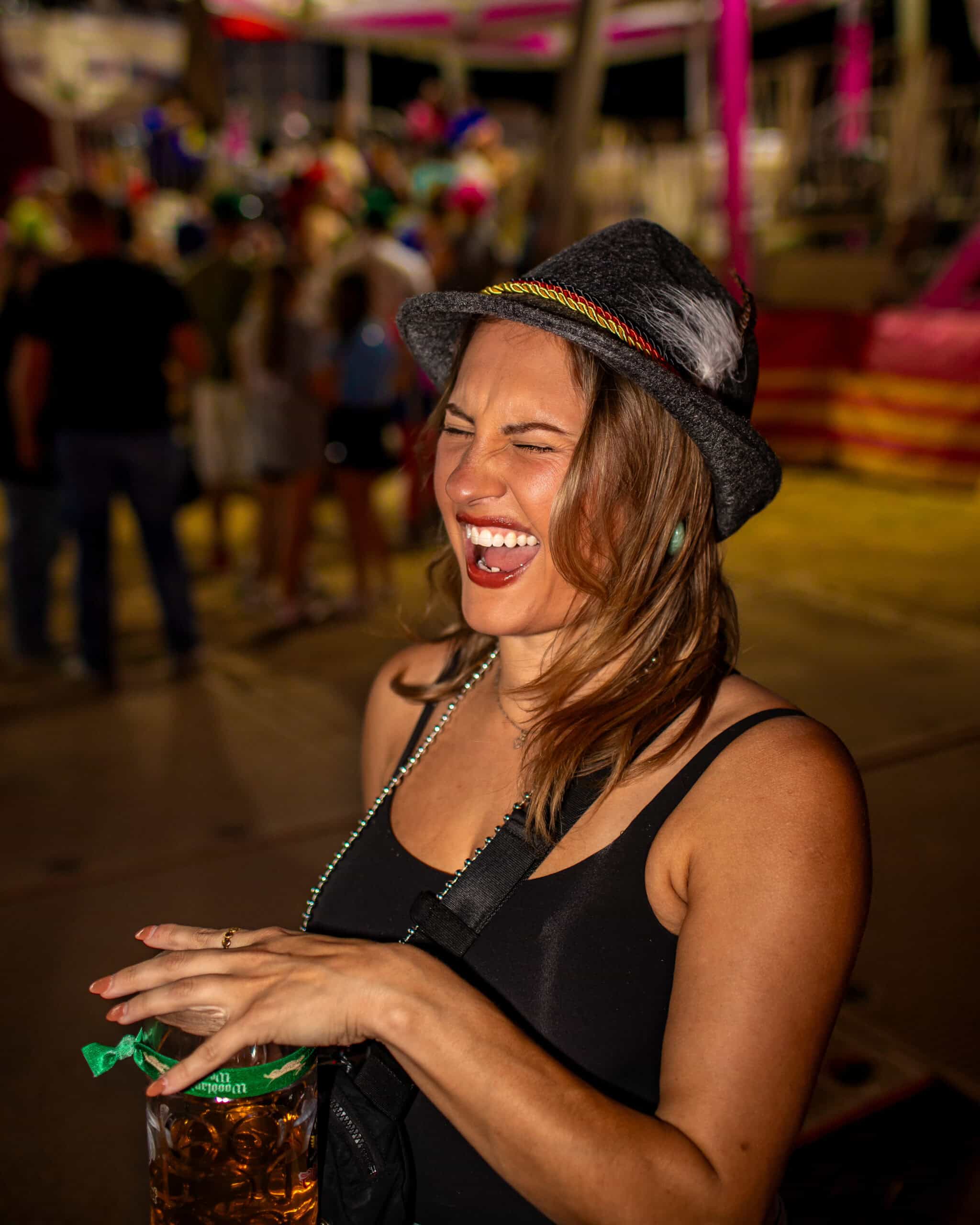 Happy woman laughing at fair or carnival.