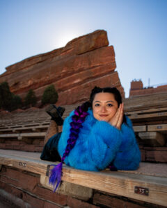 Artistic color photograph of a woman posing at Red Rocks Amp in Colorado